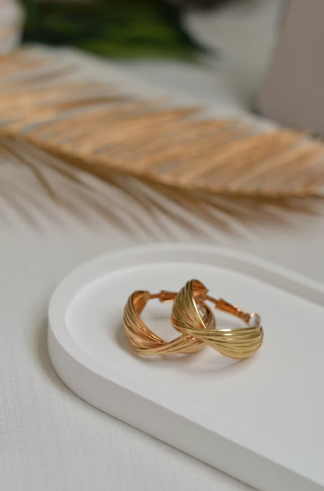Gold twisted hoop earrings by Zari & Zevar