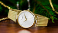 Gold mesh-strap womens watch with white textured dial