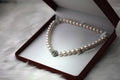 Pearl strand necklace in a red presentation box