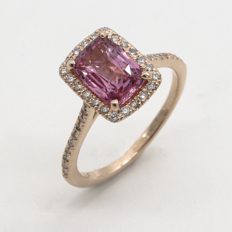 Pink sapphire halo ring in rose gold