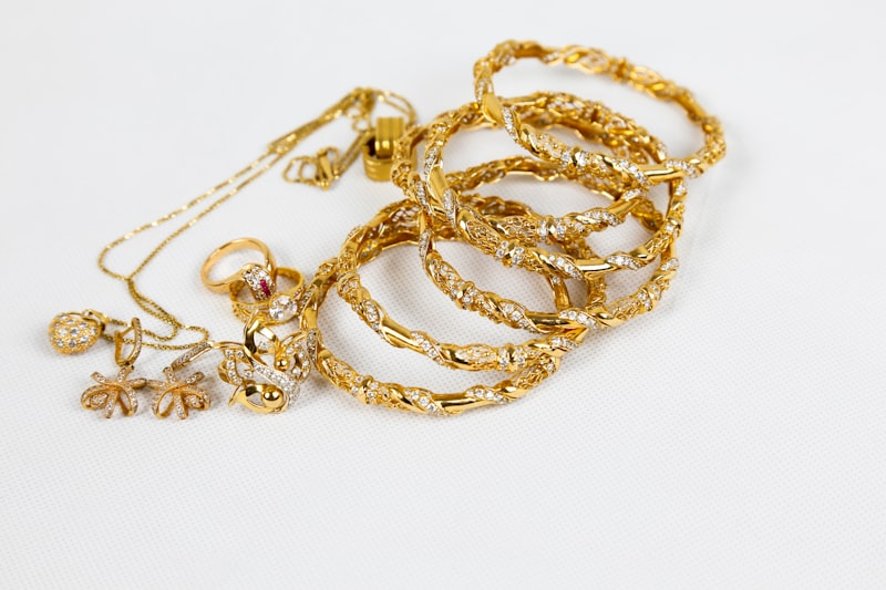 Stack of ornate antique-gold stone-studded bangles