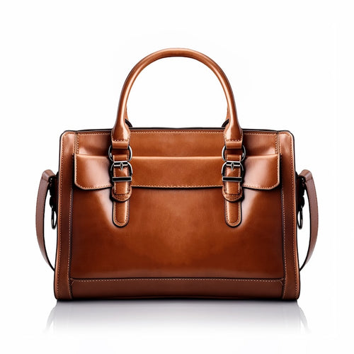 Tan cognac leather satchel handbag on a white background